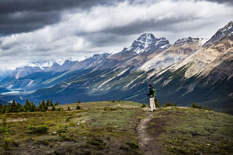 Photo of a hiker on a mountain trail